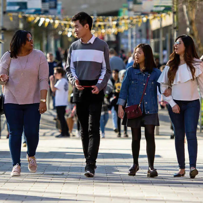 Group of students walking along the path